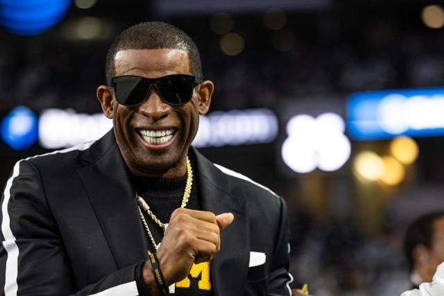 WATCH $45,000,000 in value Coach Prime receives a diamond-encrusted chain as a gift from his son, Deion Sanders Jr (2)